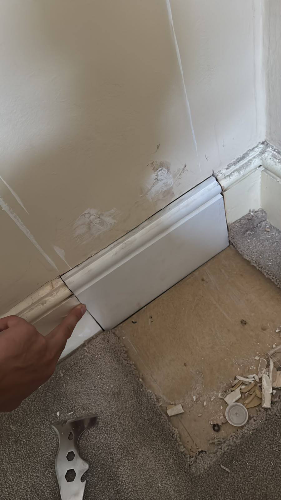Fitting a new skirting board during the repairs